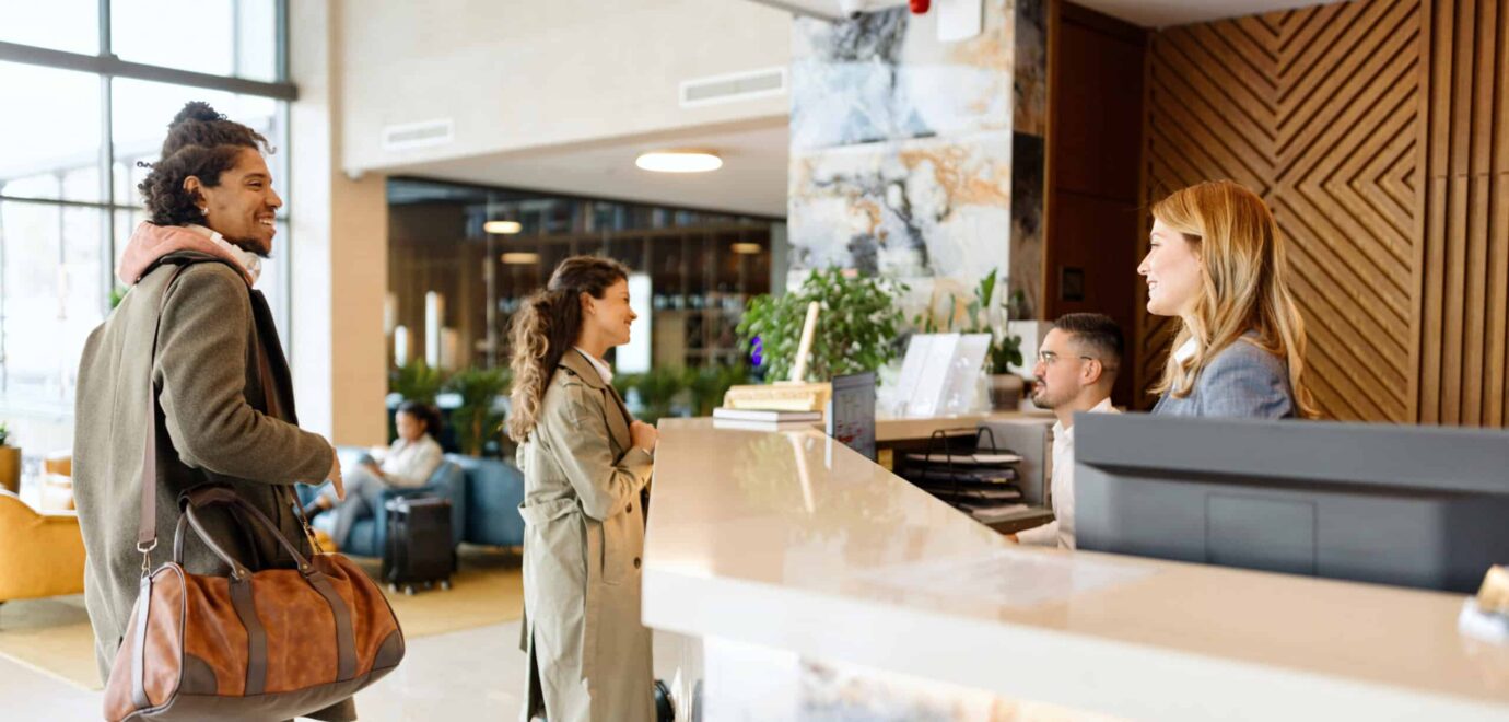 Modern people checking in at the beautiful hotel